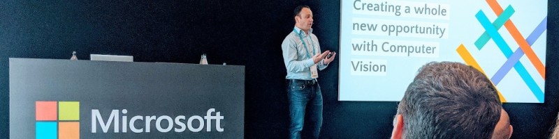 Jamie Hinton delivering keynote on stage at Microsoft